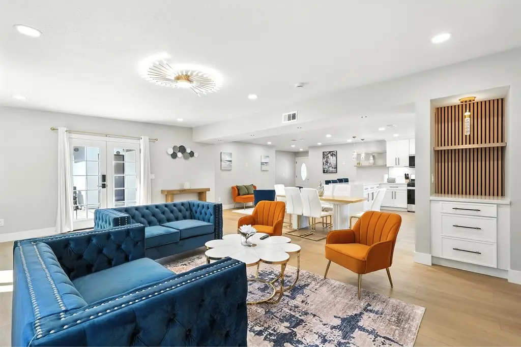 Completed whole-home remodel at 12311 Witt Rd by XLNC Builder, showing a bright open living space with modern finishes